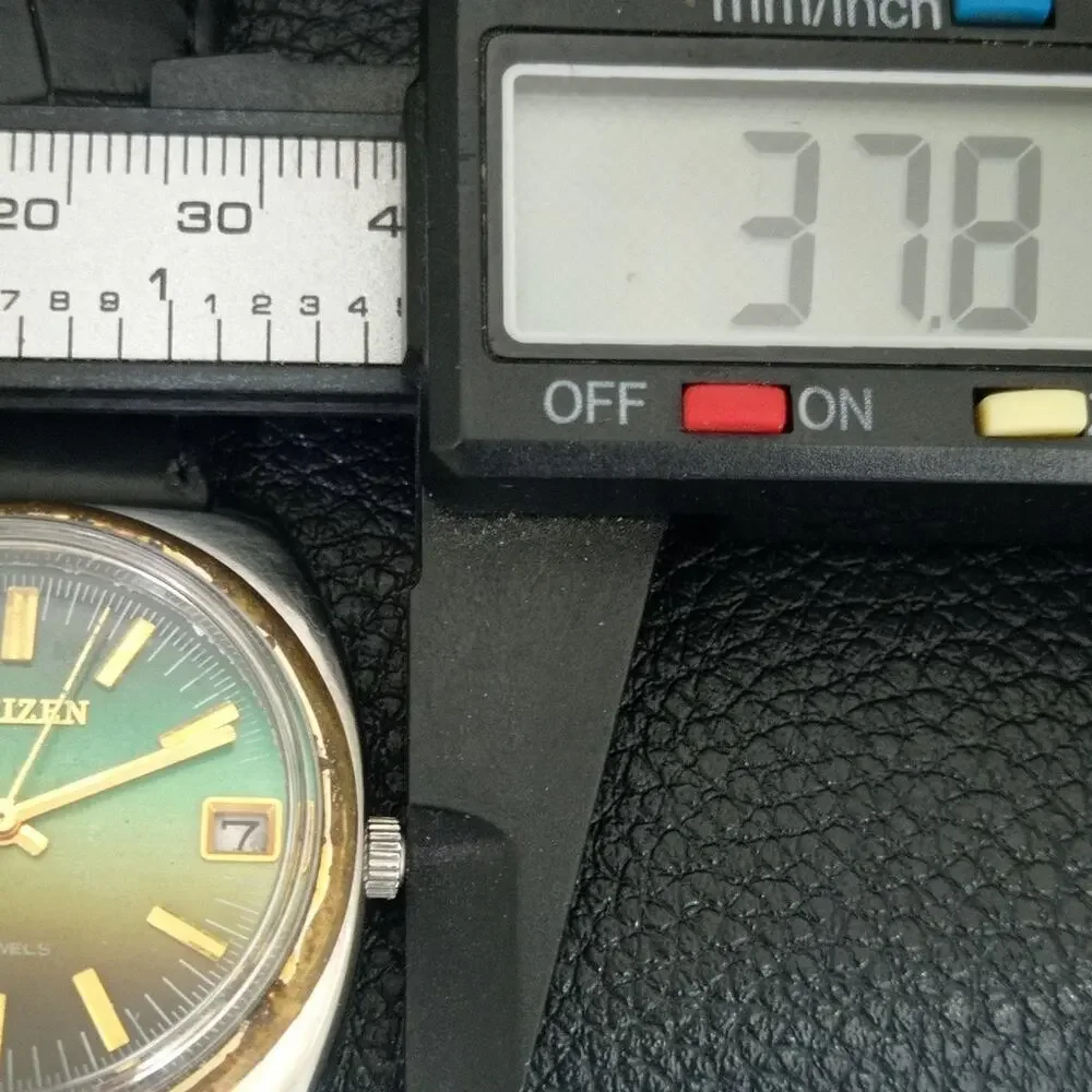 Vintage 1981 Citizen Manual Mens Silver Watch W/daydate & Green accents